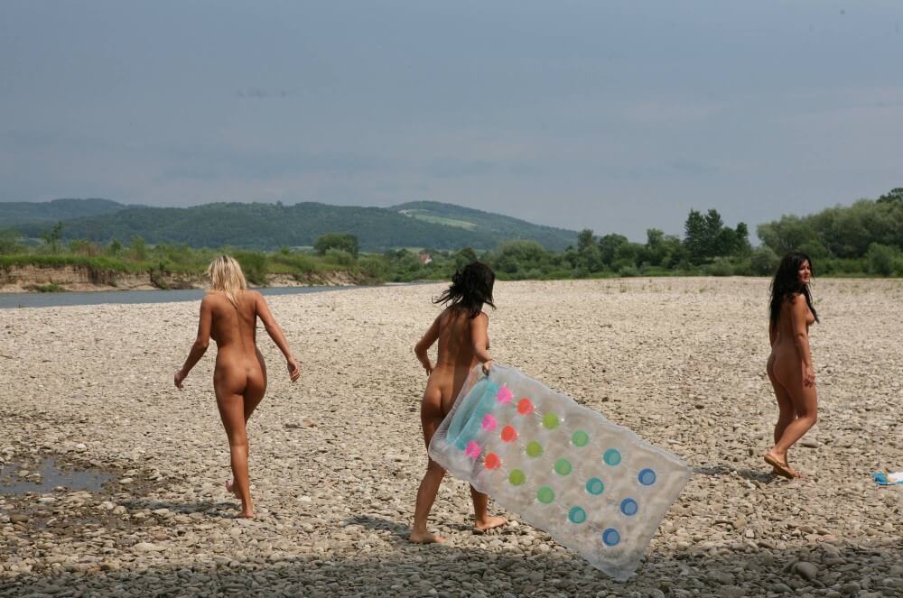 Naturist Park Floating On River photos - The Naked Human Body